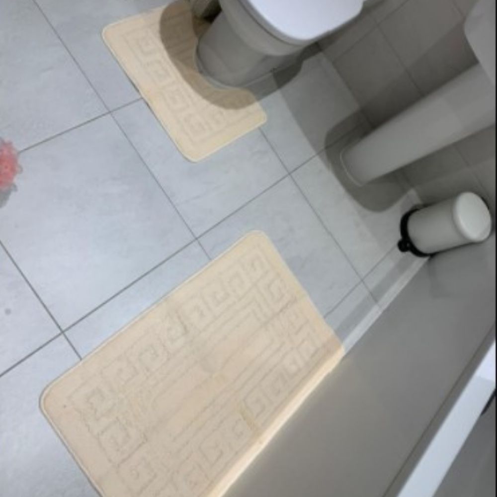 A two piece microfiber bath mat set in mocha