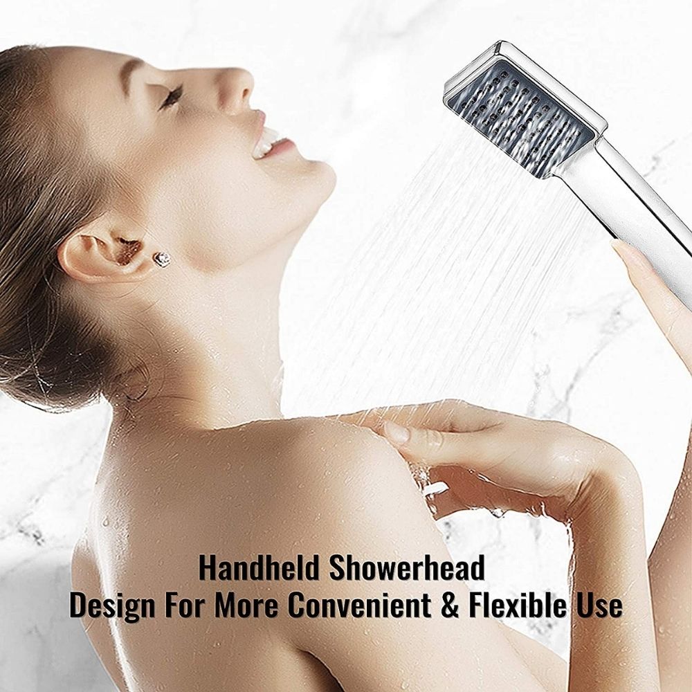 A black shower panel system with a rain head, massage jets and a handheld shower